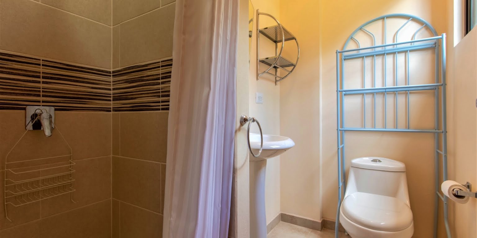27. Lower Bathroom- Two-Bedroom Jungle View Home in Gated Community with Community Waterfall & Pool in Tres Rios Costa Rica