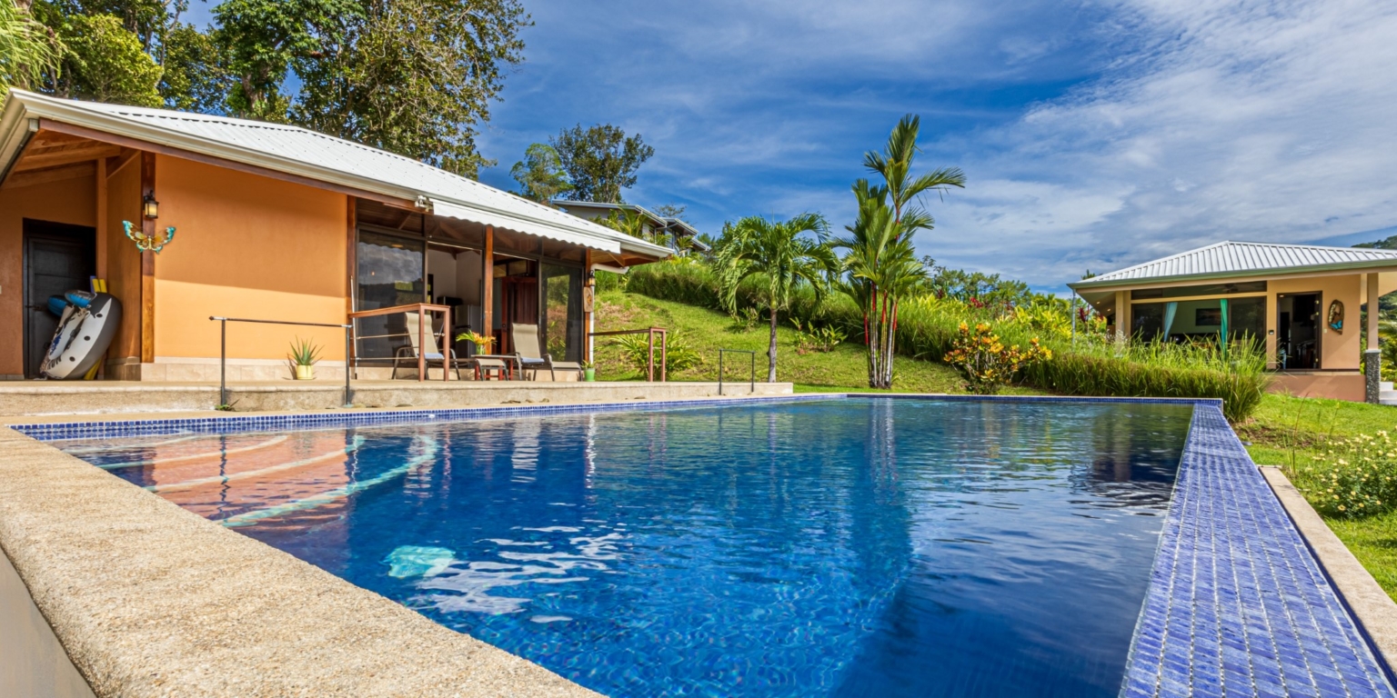 Invest in this Solid 4-Bedroom Home with Possible ROI from Renting out the Home & Guest Houses in Portalon near Dominical Costa Rica
