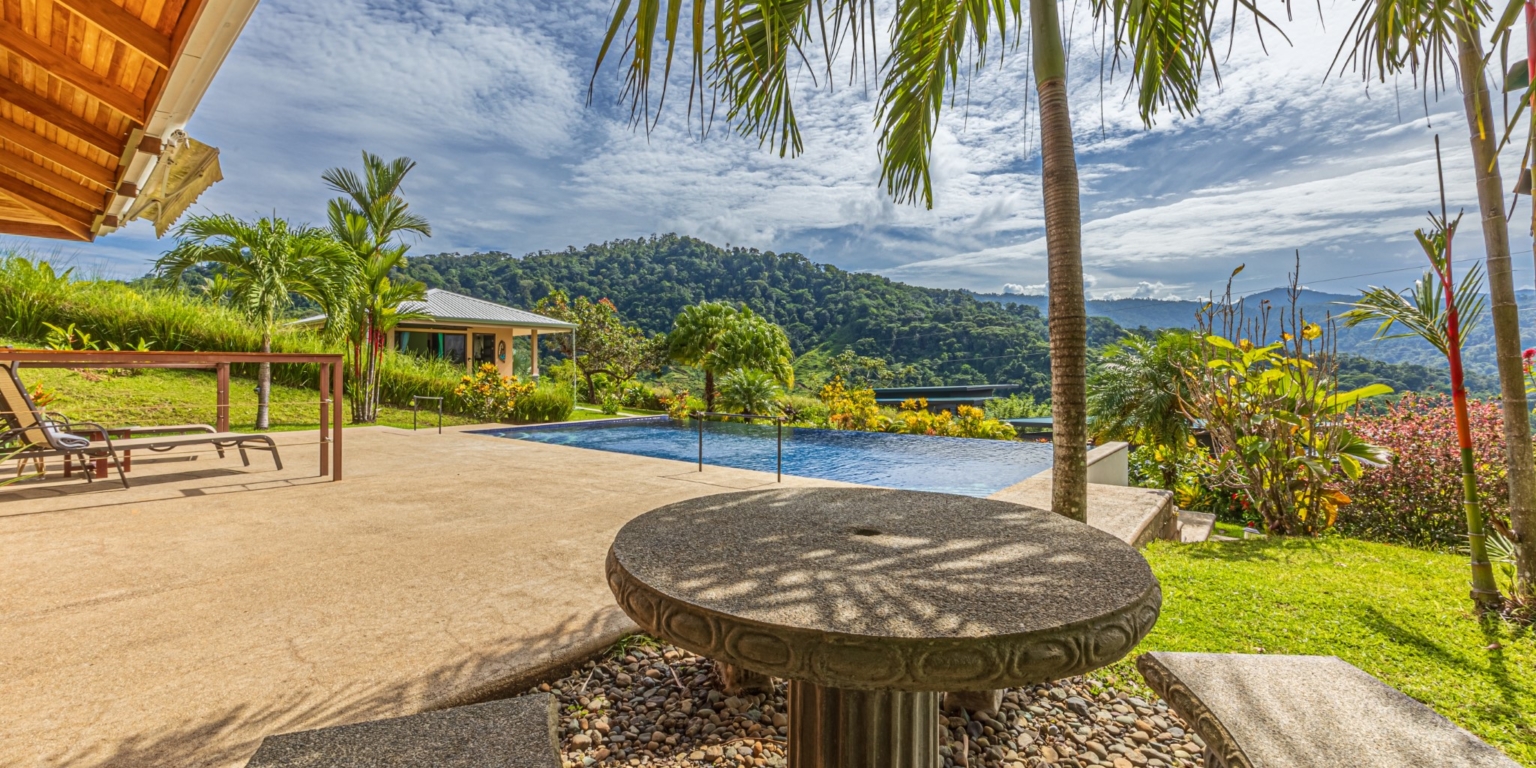 Invest in this Solid 4-Bedroom Home with Possible ROI from Renting out the Home & Guest Houses in Portalon near Dominical Costa Rica