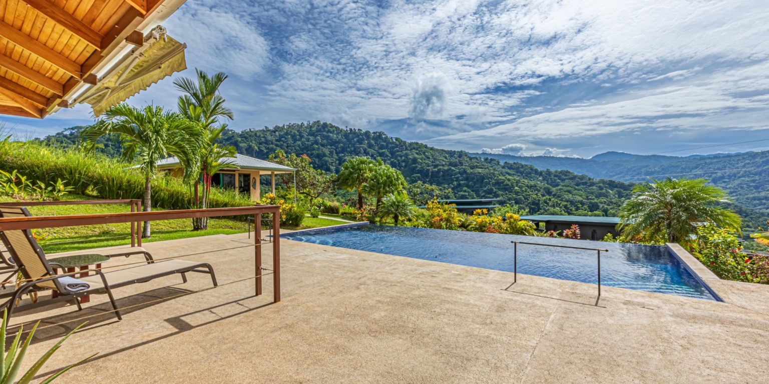 Invest in this Solid 4-Bedroom Home with Possible ROI from Renting out the Home & Guest Houses in Portalon near Dominical Costa Rica