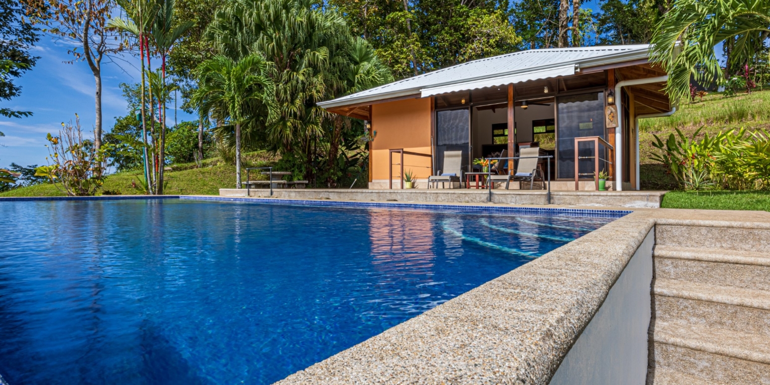 Invest in this Solid 4-Bedroom Home with Possible ROI from Renting out the Home & Guest Houses in Portalon near Dominical Costa Rica