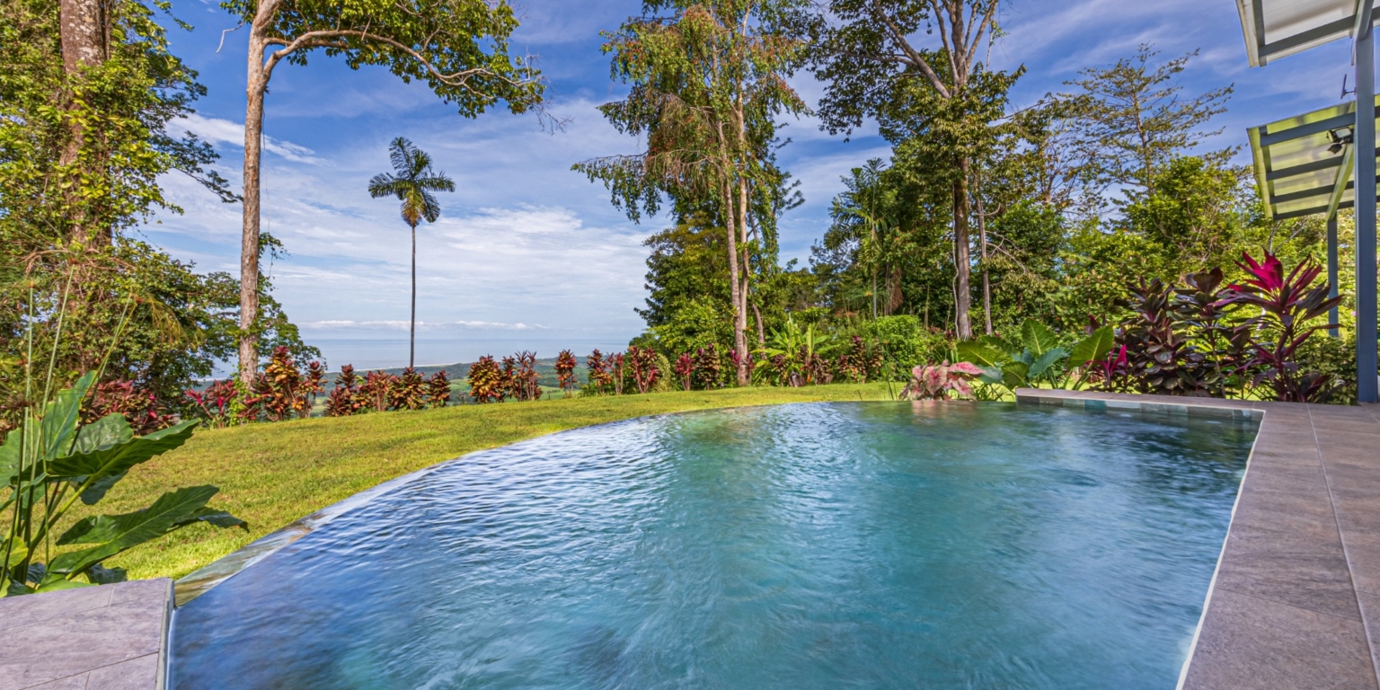 Invest in this Solid 4-Bedroom Home with Possible ROI from Renting out the Home & Guest Houses in Portalon near Dominical Costa Rica