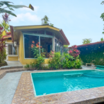 Cozy Colonial Home with Lush Gardens and Prime Commercial Prospects in Ojochal Costa Rica