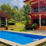 House with 3-Bedrooms & Guest House on Over 4 Acres Backing onto Year-Round River in Ojochal Costa Rica