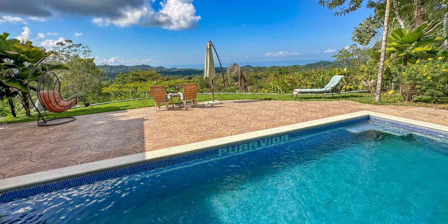 23 (1) Ocean View 3-Bedroom Home with Easy Access and Sparkling Pool in Ojochal Costa Rica