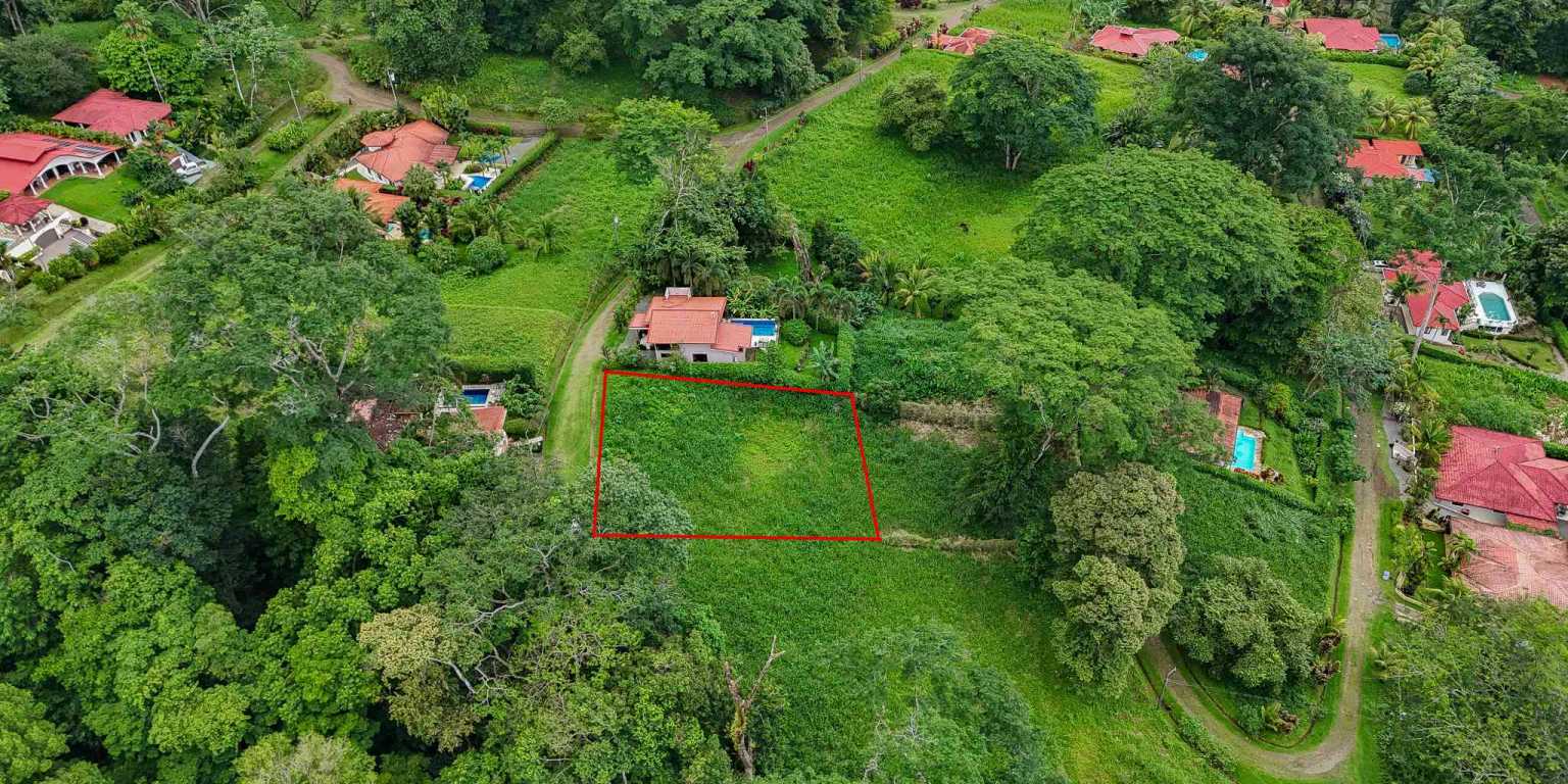 100 (6) Beautiful Sunny Lot in a Secure Gated Community with a Nearby Creek & Jungle-Covered Valley in Ojochal Costa Rica