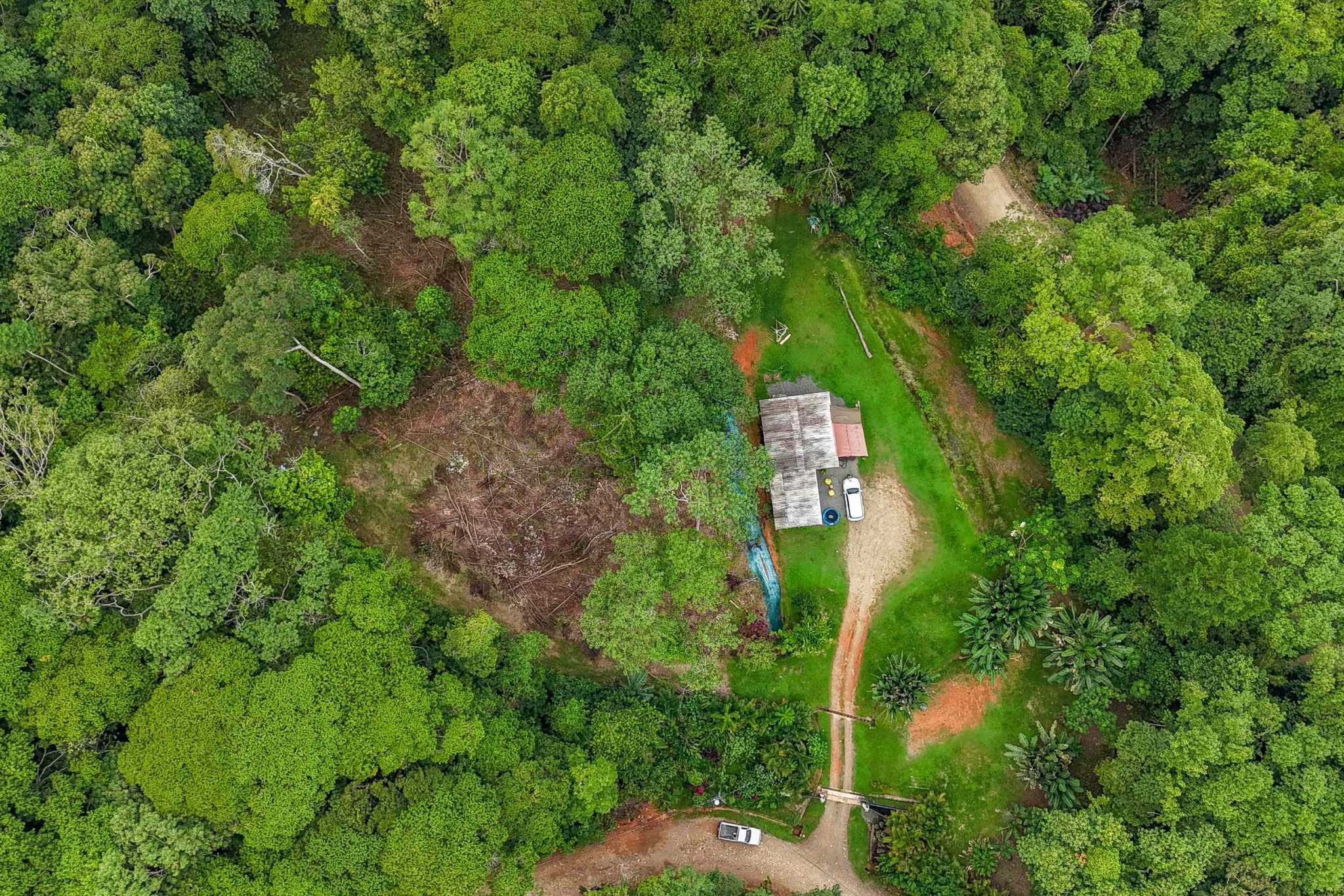 41167 (2) Large 2.1 Acre Jungle Property with a 1-Bed home & Numerous Additional Building Sites on Cinco Ventanas Road in Ojochal Costa Rica