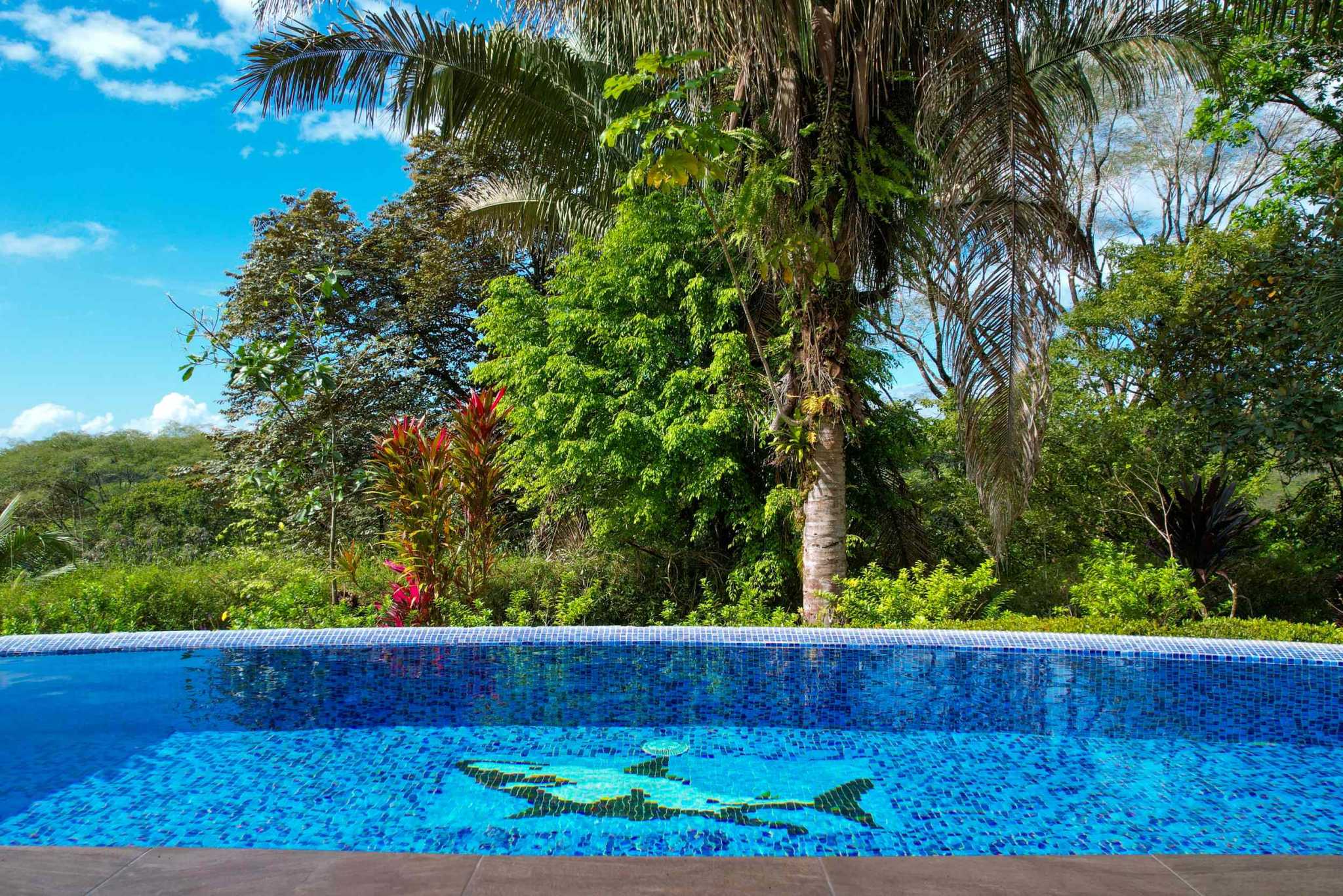 Charming 3 Bedroom Home on Lush Acreage with Pocket Ocean View in Ojochal Costa Rica