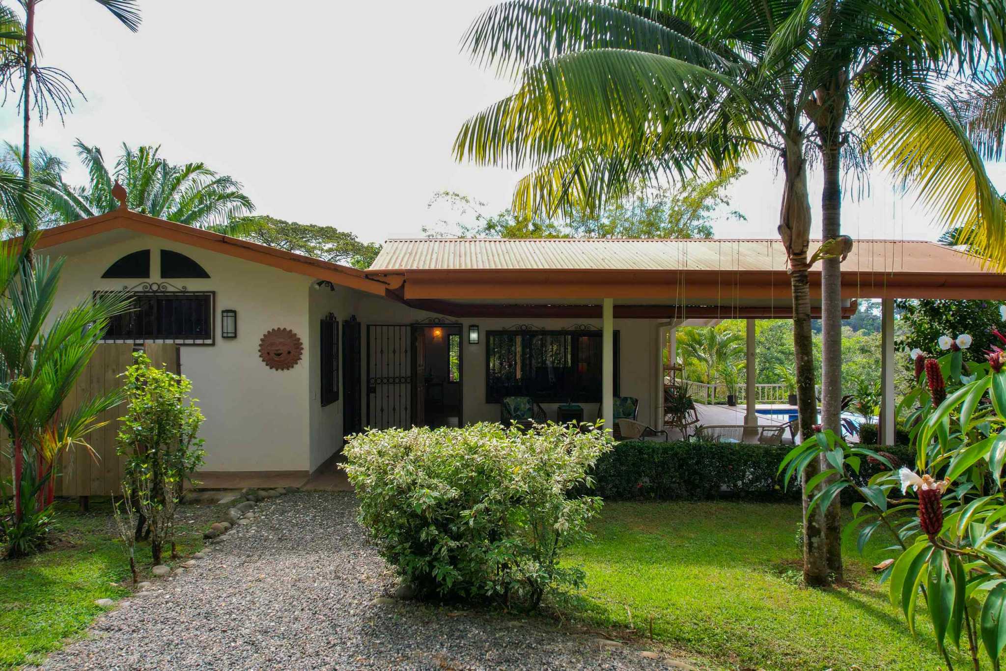 Charming 3 Bedroom Home on Lush Acreage with Pocket Ocean View in Ojochal Costa Rica