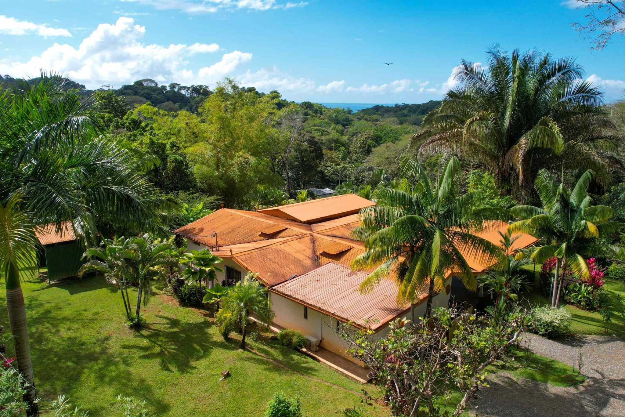 Charming 3 Bedroom Home on Lush Acreage with Pocket Ocean View in Ojochal Costa Rica