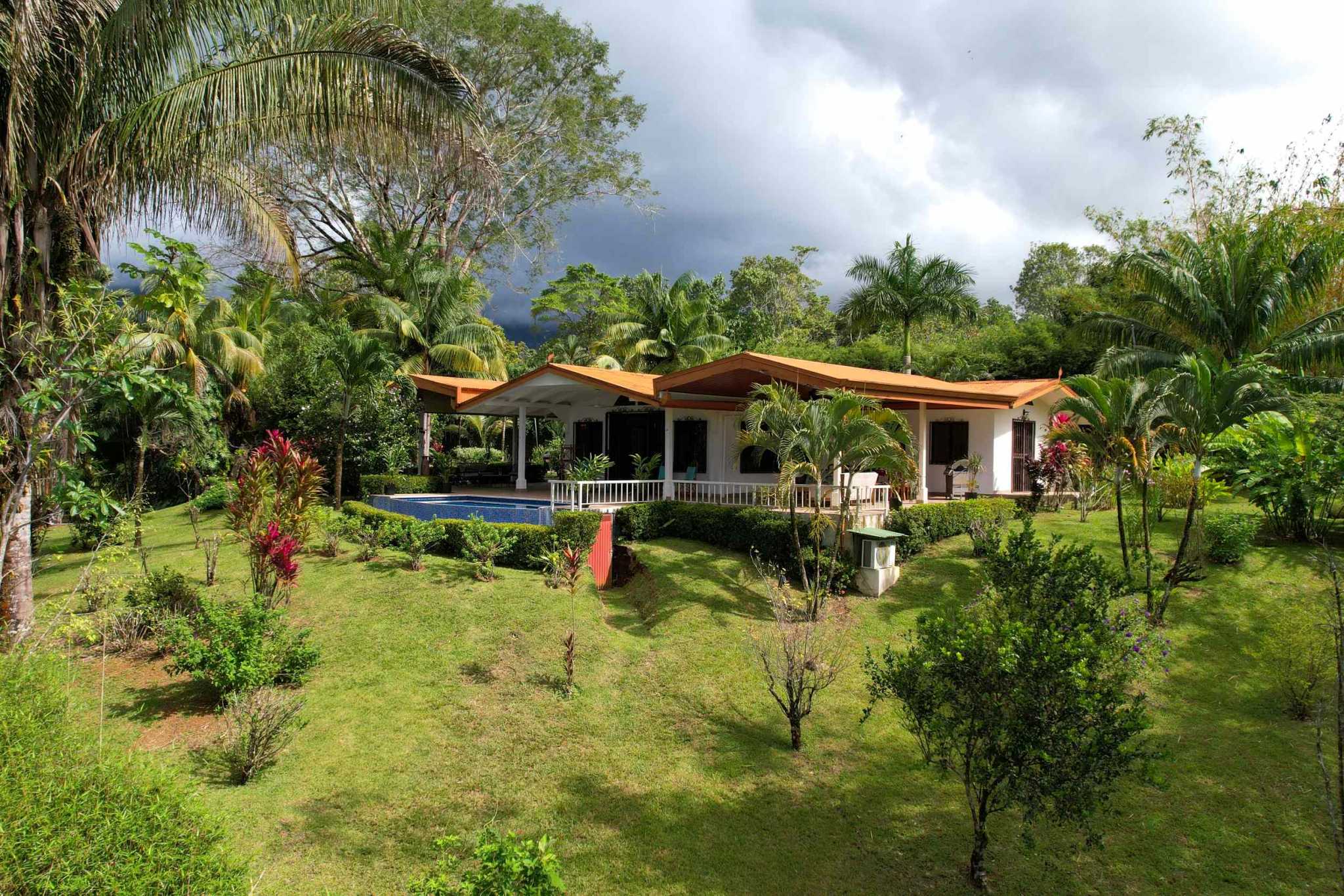 Charming 3 Bedroom Home on Lush Acreage with Pocket Ocean View in Ojochal Costa Rica