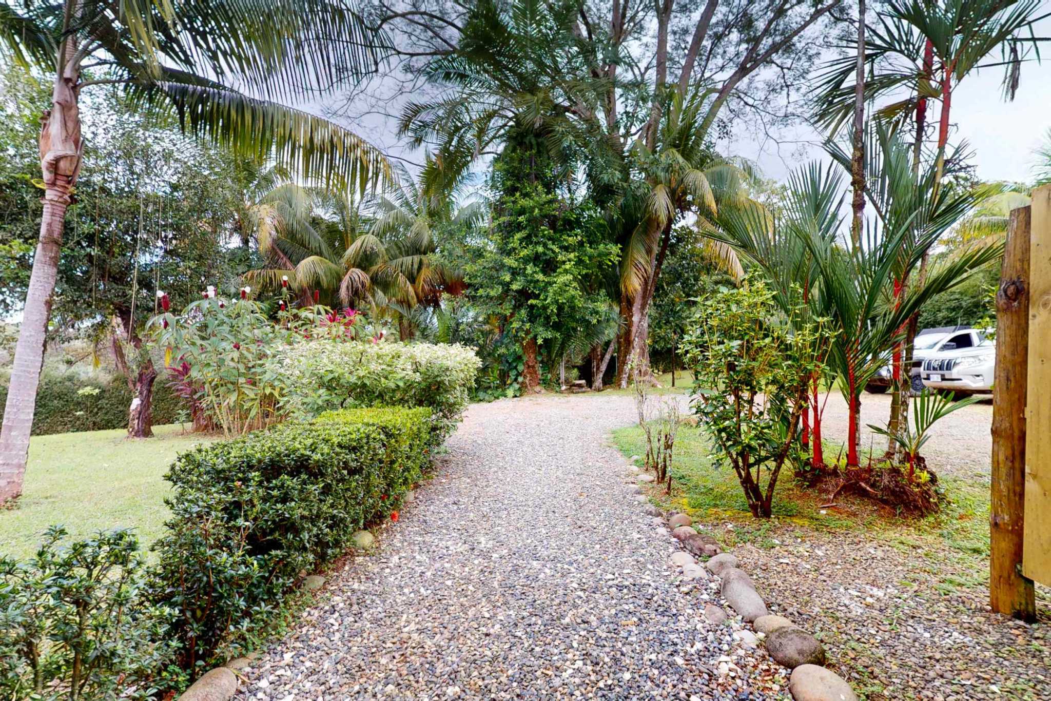 Charming 3 Bedroom Home on Lush Acreage with Pocket Ocean View in Ojochal Costa Rica
