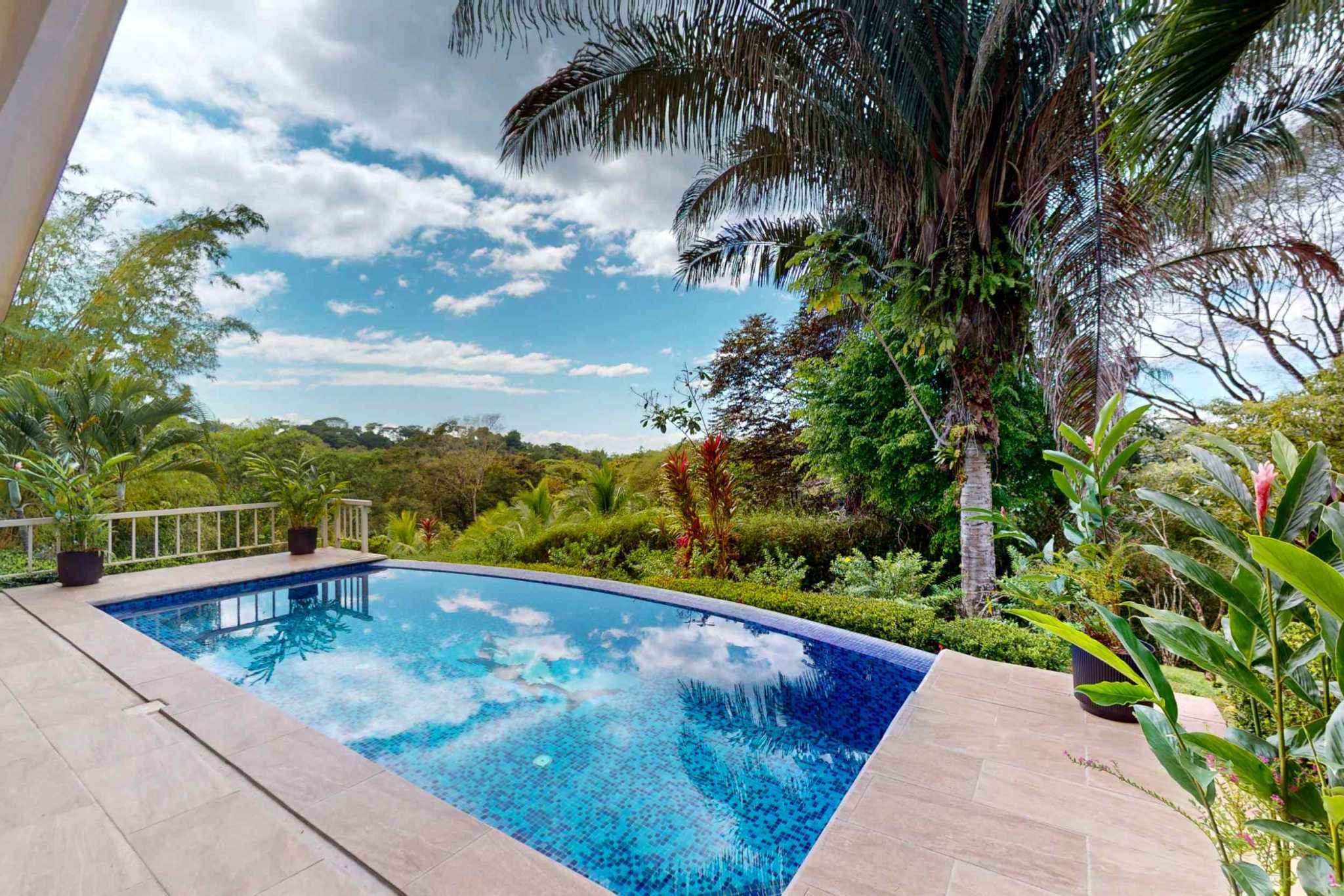 Charming 3 Bedroom Home on Lush Acreage with Pocket Ocean View in Ojochal Costa Rica