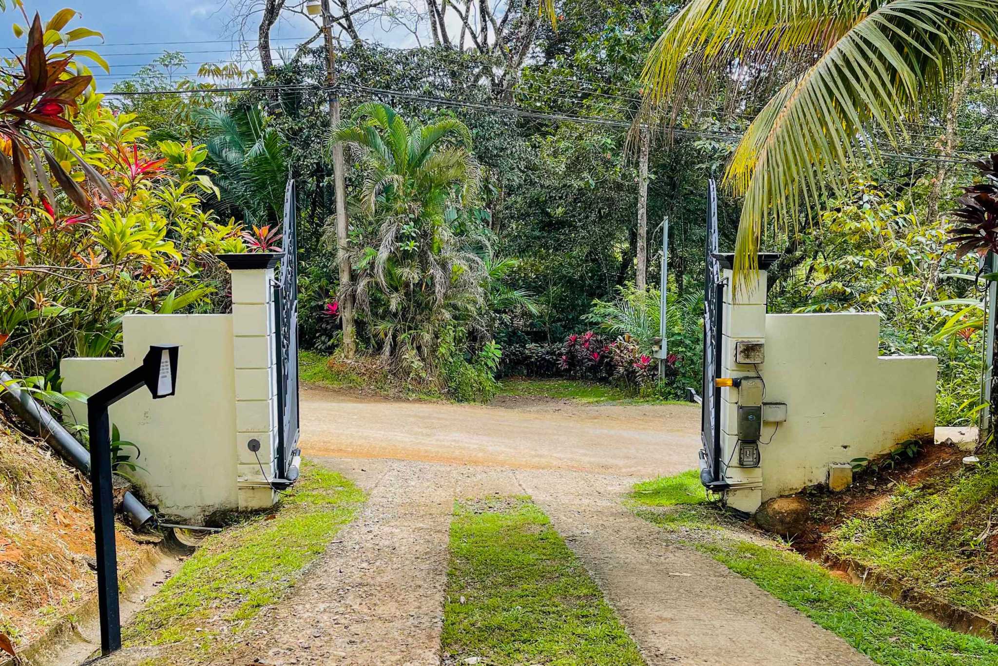 Charming 3 Bedroom Home on Lush Acreage with Pocket Ocean View in Ojochal Costa Rica