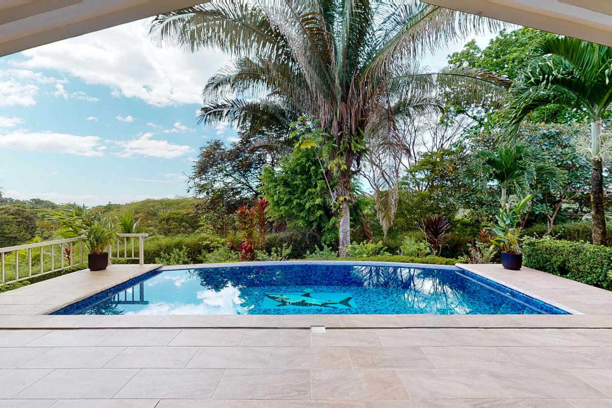 Charming 3 Bedroom Home on Lush Acreage with Pocket Ocean View in Ojochal Costa Rica