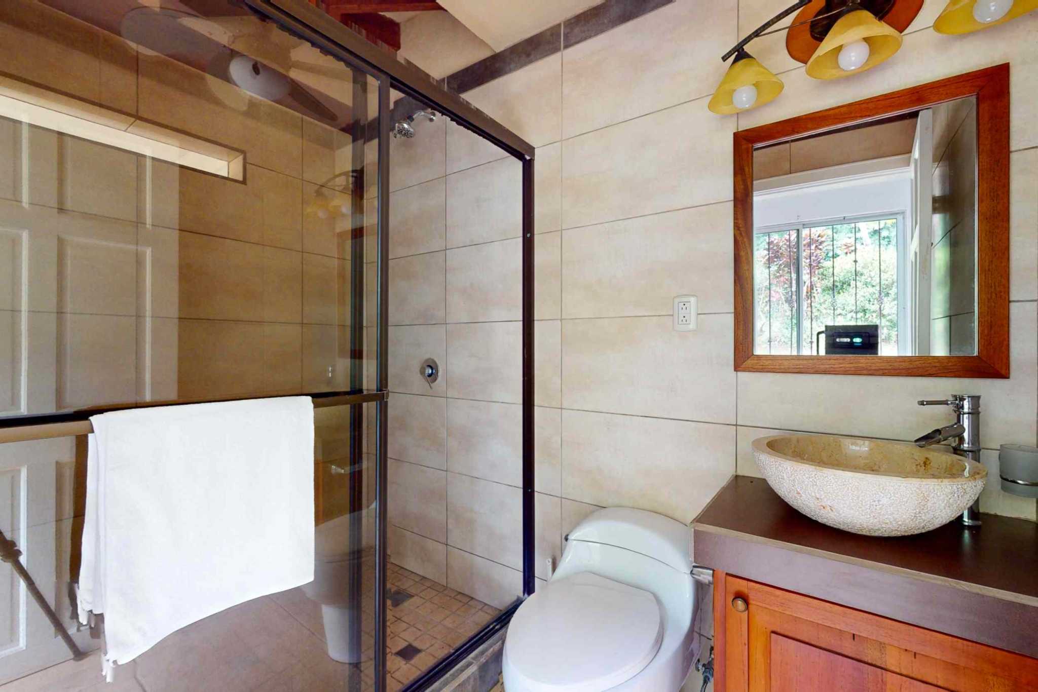 Charming 3 Bedroom Home on Lush Acreage with Pocket Ocean View in Ojochal Costa Rica