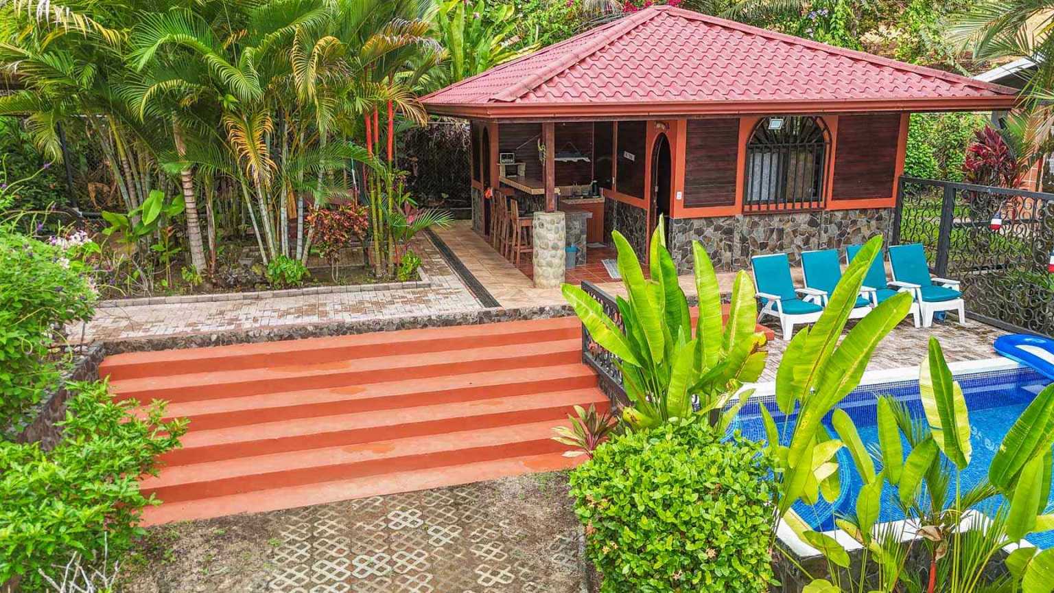 42517 (45) Beautiful Half-Acre Property in the Heart of Ojochal with Mountain Views, Traditional Homes, Pool, Lush Mature Gardens Priced to Sell in Ojochal Costa Rica