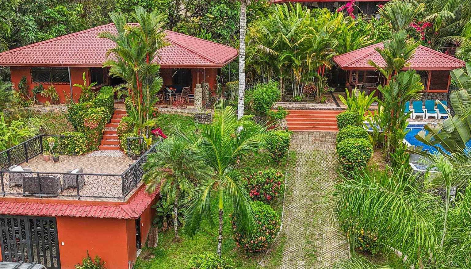 42517 (11) Beautiful Half-Acre Property in the Heart of Ojochal with Mountain Views, Traditional Homes, Pool, Lush Mature Gardens Priced to Sell in Ojochal Costa Rica