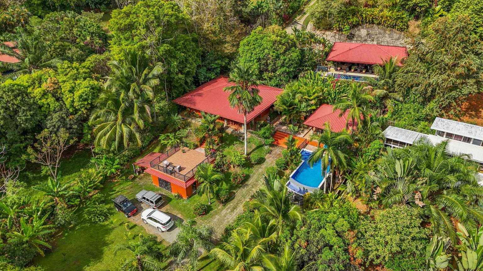 42517 (13) Beautiful Half-Acre Property in the Heart of Ojochal with Mountain Views, Traditional Homes, Pool, Lush Mature Gardens Priced to Sell in Ojochal Costa Rica