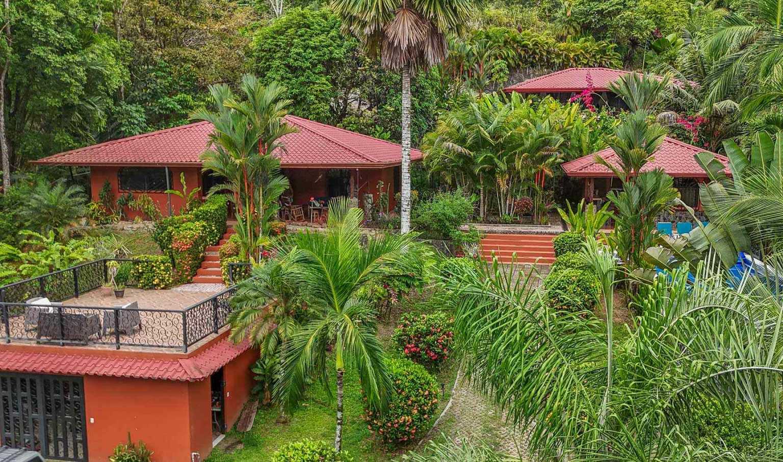 42517 (15) Beautiful Half-Acre Property in the Heart of Ojochal with Mountain Views, Traditional Homes, Pool, Lush Mature Gardens Priced to Sell in Ojochal Costa Rica
