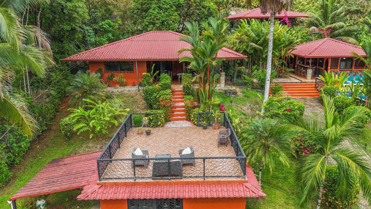 42517 (27) Beautiful Half-Acre Property in the Heart of Ojochal with Mountain Views, Traditional Homes, Pool, Lush Mature Gardens Priced to Sell in Ojochal Costa Rica
