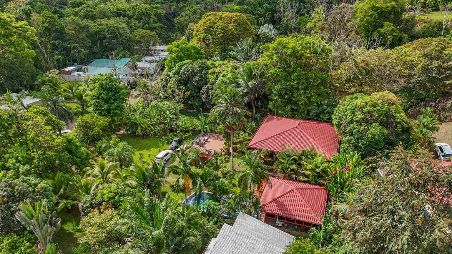 42517 (29) Beautiful Half-Acre Property in the Heart of Ojochal with Mountain Views, Traditional Homes, Pool, Lush Mature Gardens Priced to Sell in Ojochal Costa Rica