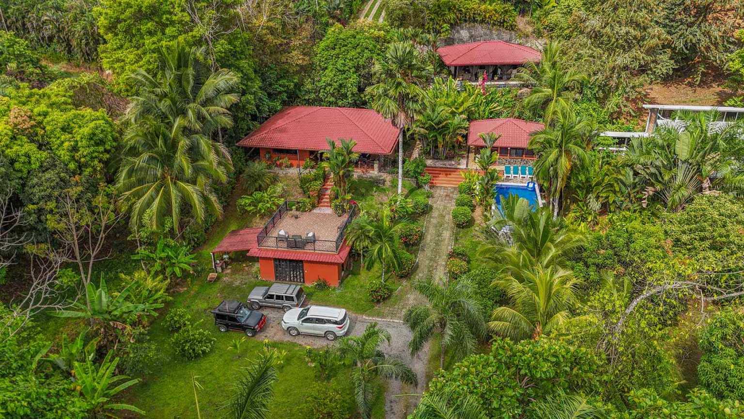 42517 (32) Beautiful Half-Acre Property in the Heart of Ojochal with Mountain Views, Traditional Homes, Pool, Lush Mature Gardens Priced to Sell in Ojochal Costa Rica