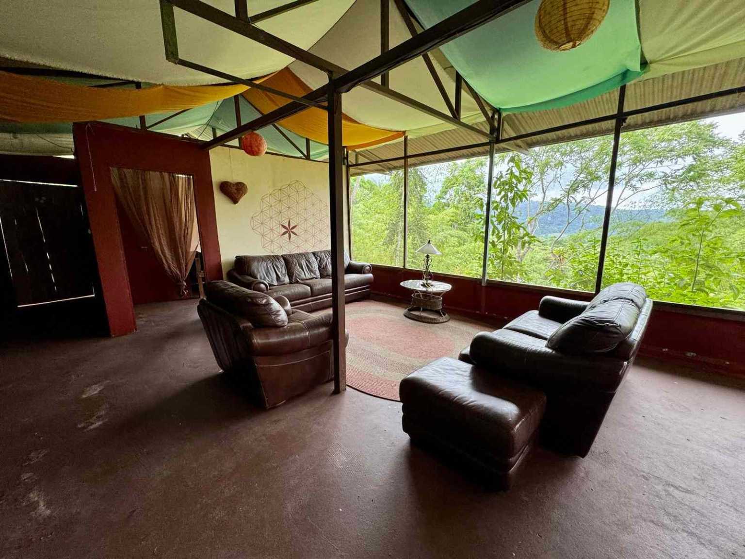 47892 (71) Off-Grid 2-Bedroom Home Plus 2 Guest Cabins, Fruit Trees, River Access, Mountain Views & Small Ocean View on 5+ Acres in Tinamastes Costa Rica