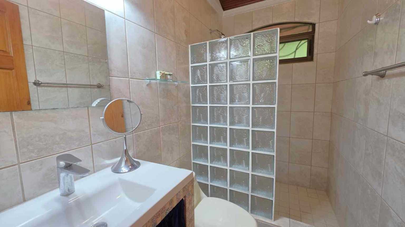 30753 (16) Easy-Access Home with Beautiful Outdoor Living Space, Pool & Garden in Ojochal Costa Rica