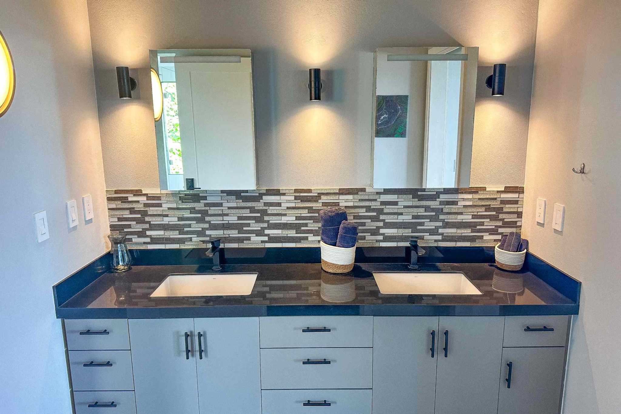 Mountain & Ocean View Retreat double vanity bathroom with mosaic backsplash in Ojochal, Costa Rica