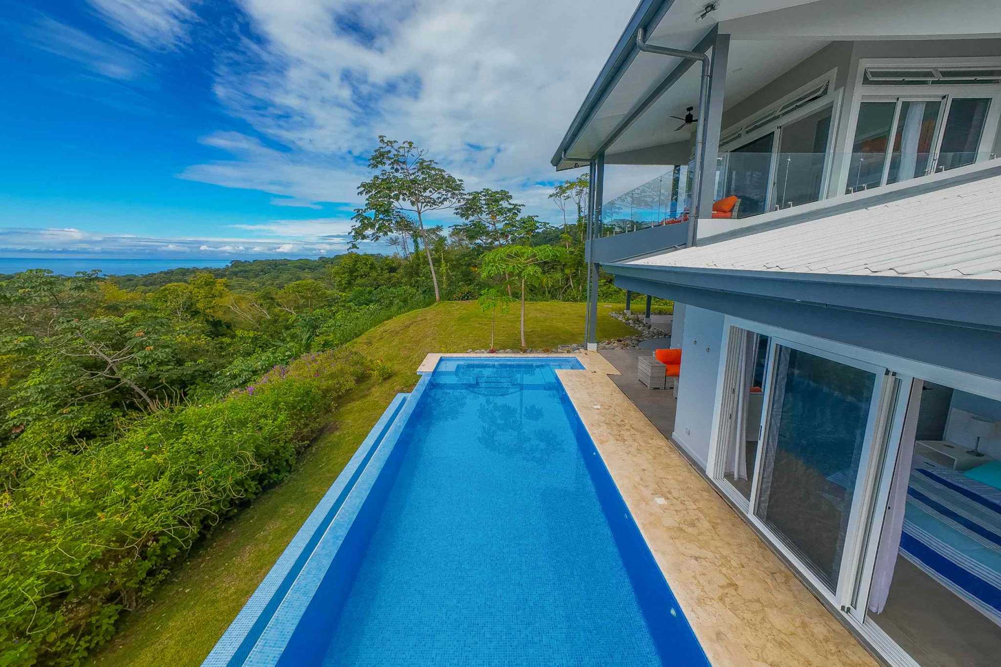 Luxury Retreat home with infinity pool overlooking jungle canopy and ocean horizon in Ojochal, Costa Rica