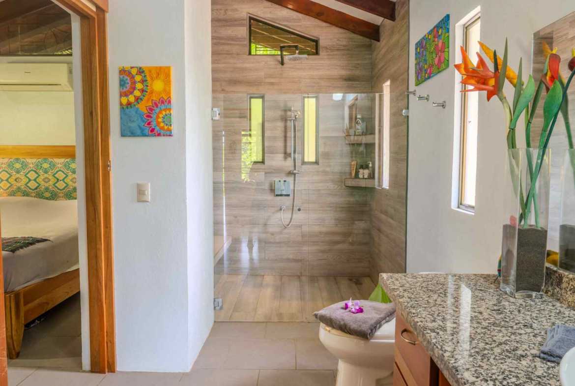 2-Bedroom Costa Rica Home bathroom with glass walk-in shower and granite vanity in Ojochal, Costa Rica