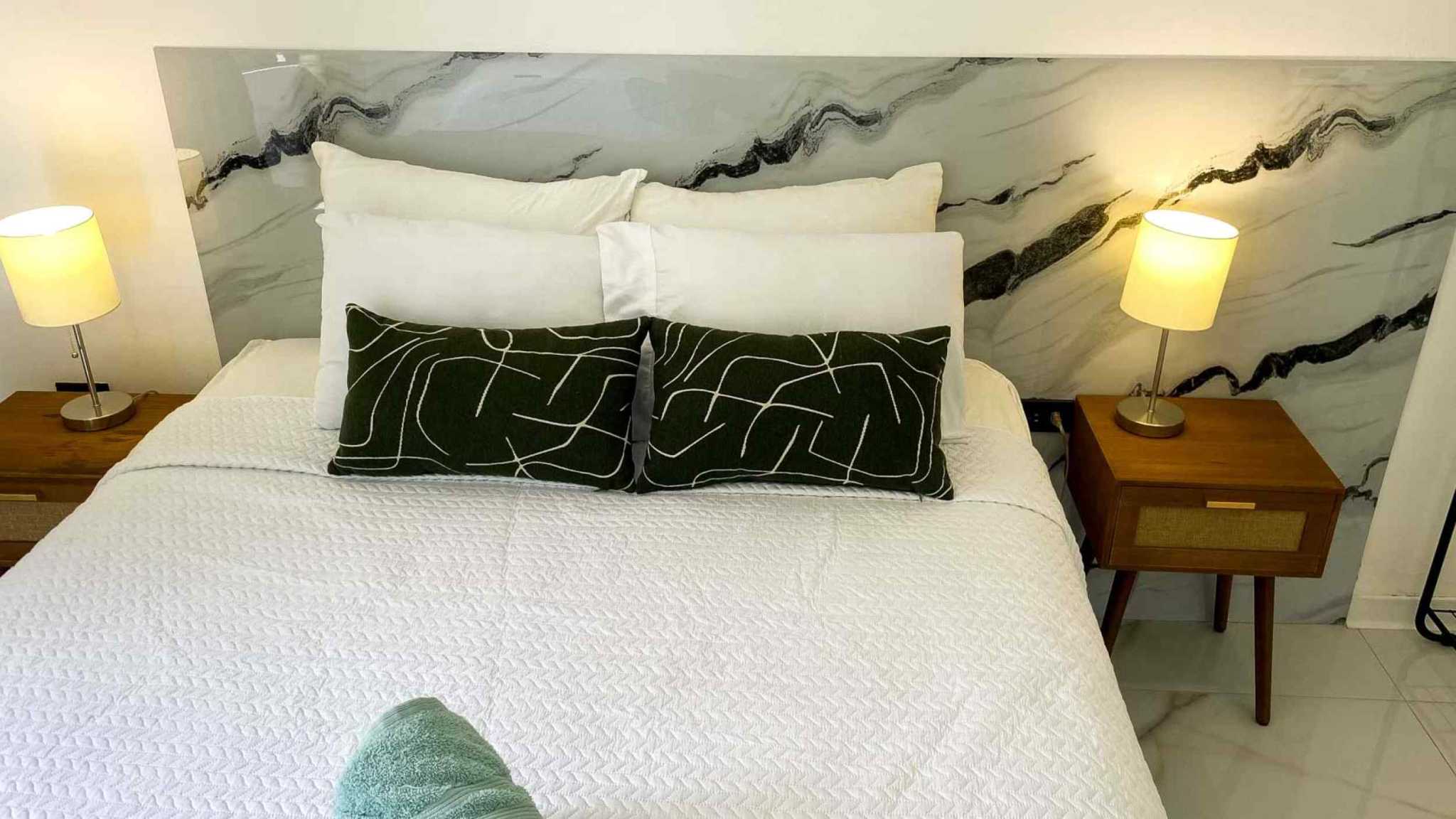 55856-17 3-Bedroom Home with Pool: bed with marble-look headboard, wood nightstands and glowing lamps in Bahia, Costa Rica