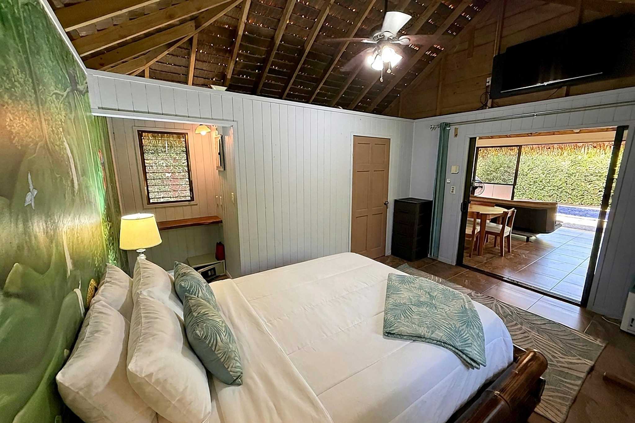 65486-19 Jungle Sanctuary bedroom with vaulted wood ceiling and sliding door to pool terrace in Ojochal, Costa Rica