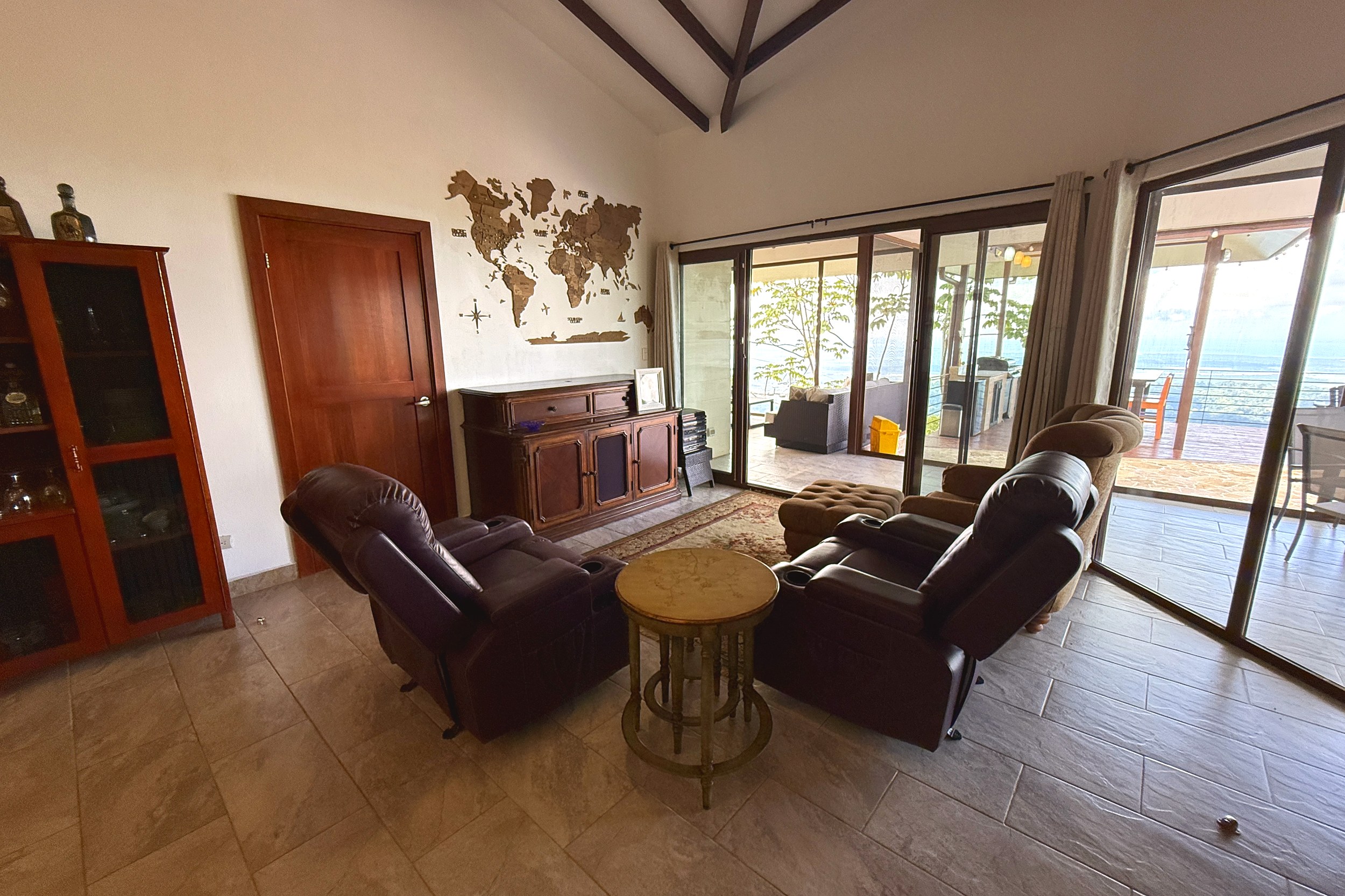 Ocean-View 3-Bedroom Home living room with recliners in Toucan Valley/Osa Mountain Village, Costa Rica
