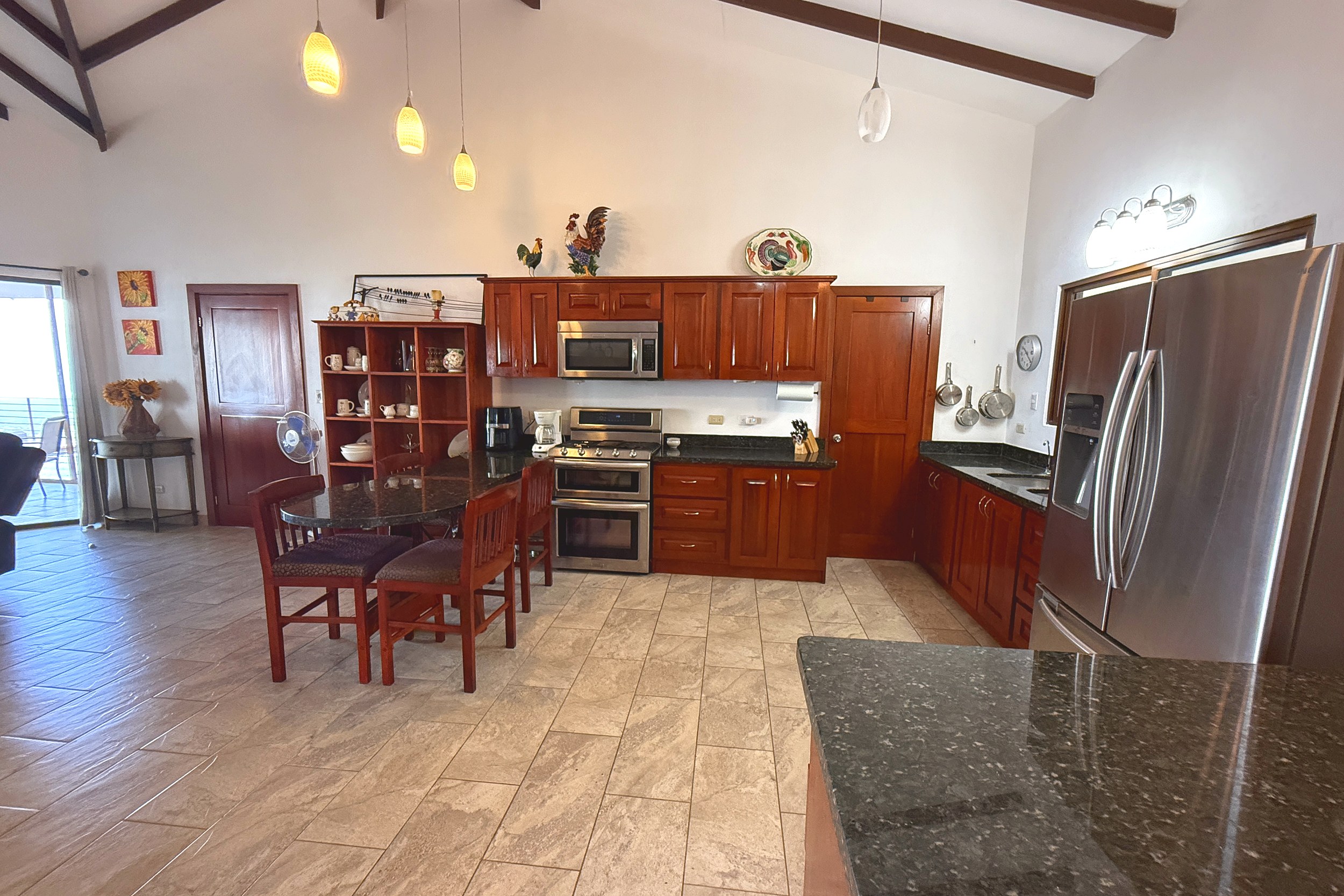 Ocean-View 3-Bedroom Home modern kitchen with wood cabinets in Toucan Valley/Osa Mountain Village, Costa Rica