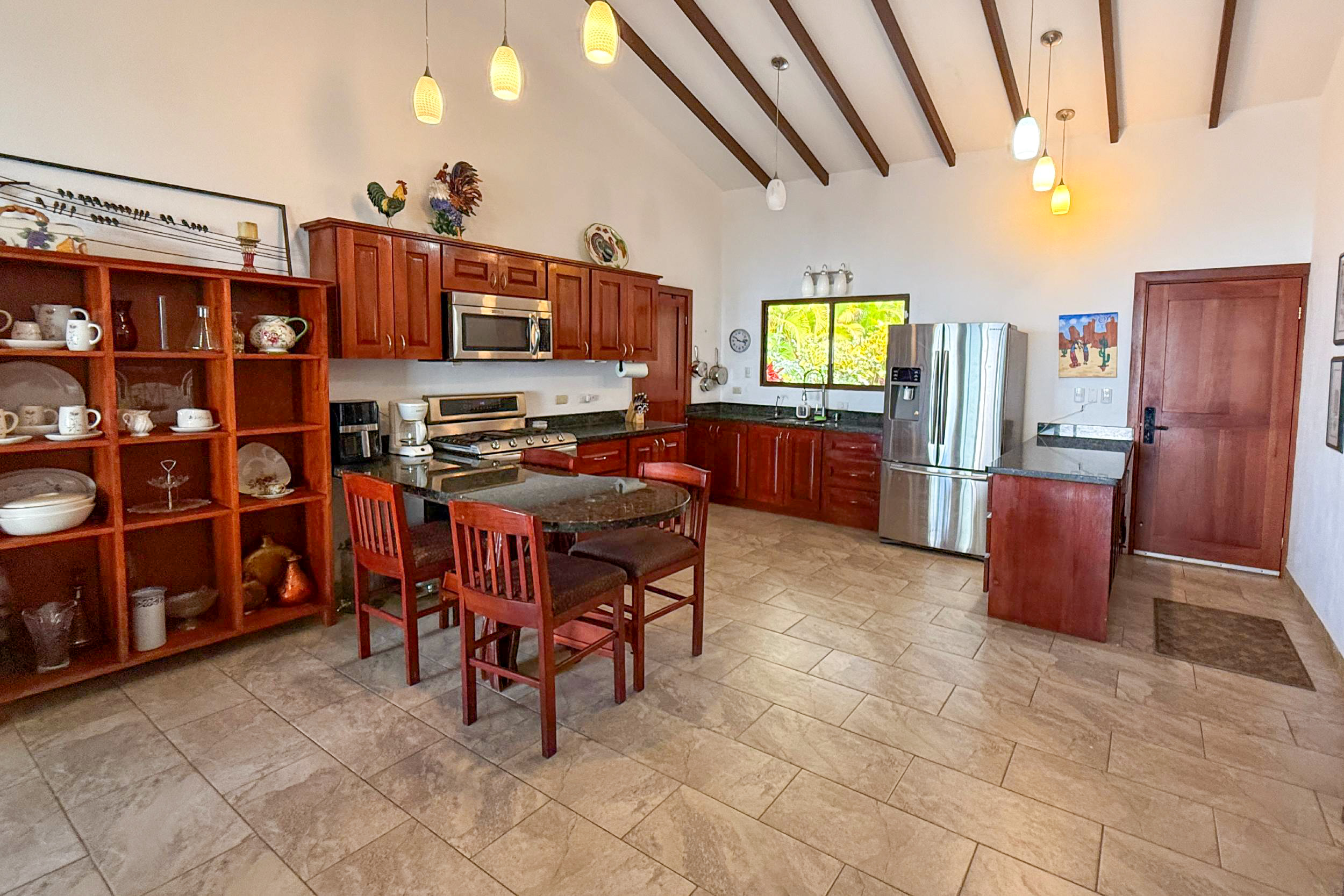 Ocean-View 3-Bedroom Home spacious kitchen with wood cabinets in Toucan Valley/Osa Mountain Village, Costa Rica