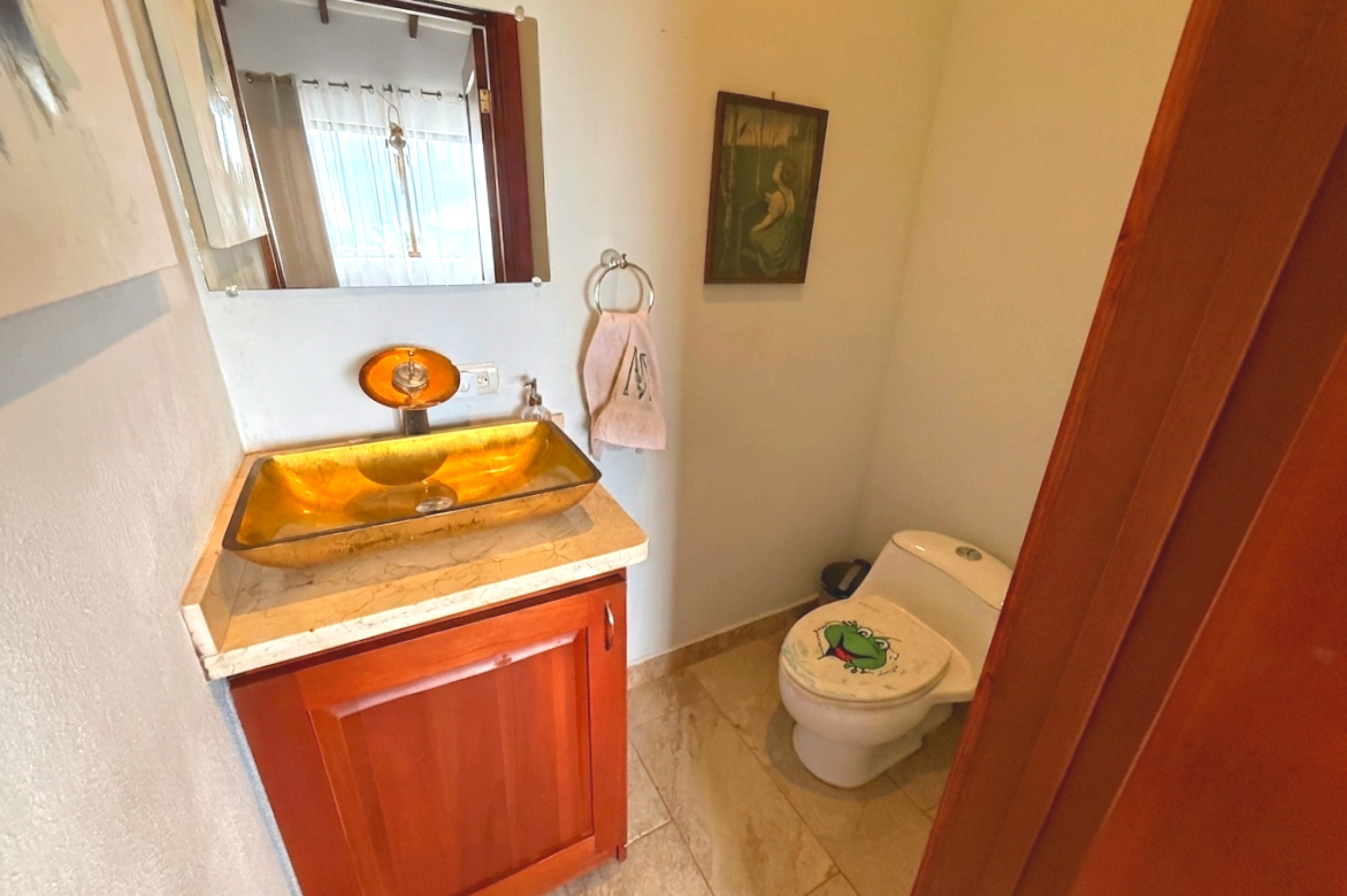 Ocean-View 3-Bedroom Home guest bathroom with gold sink in Toucan Valley/Osa Mountain Village, Costa Rica