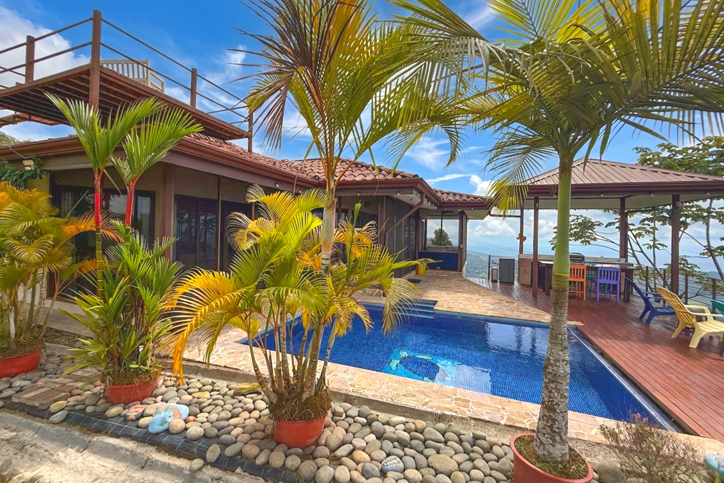 Ocean-View 3-Bedroom Home swimming pool and palm trees in Toucan Valley/Osa Mountain Village, Costa Rica