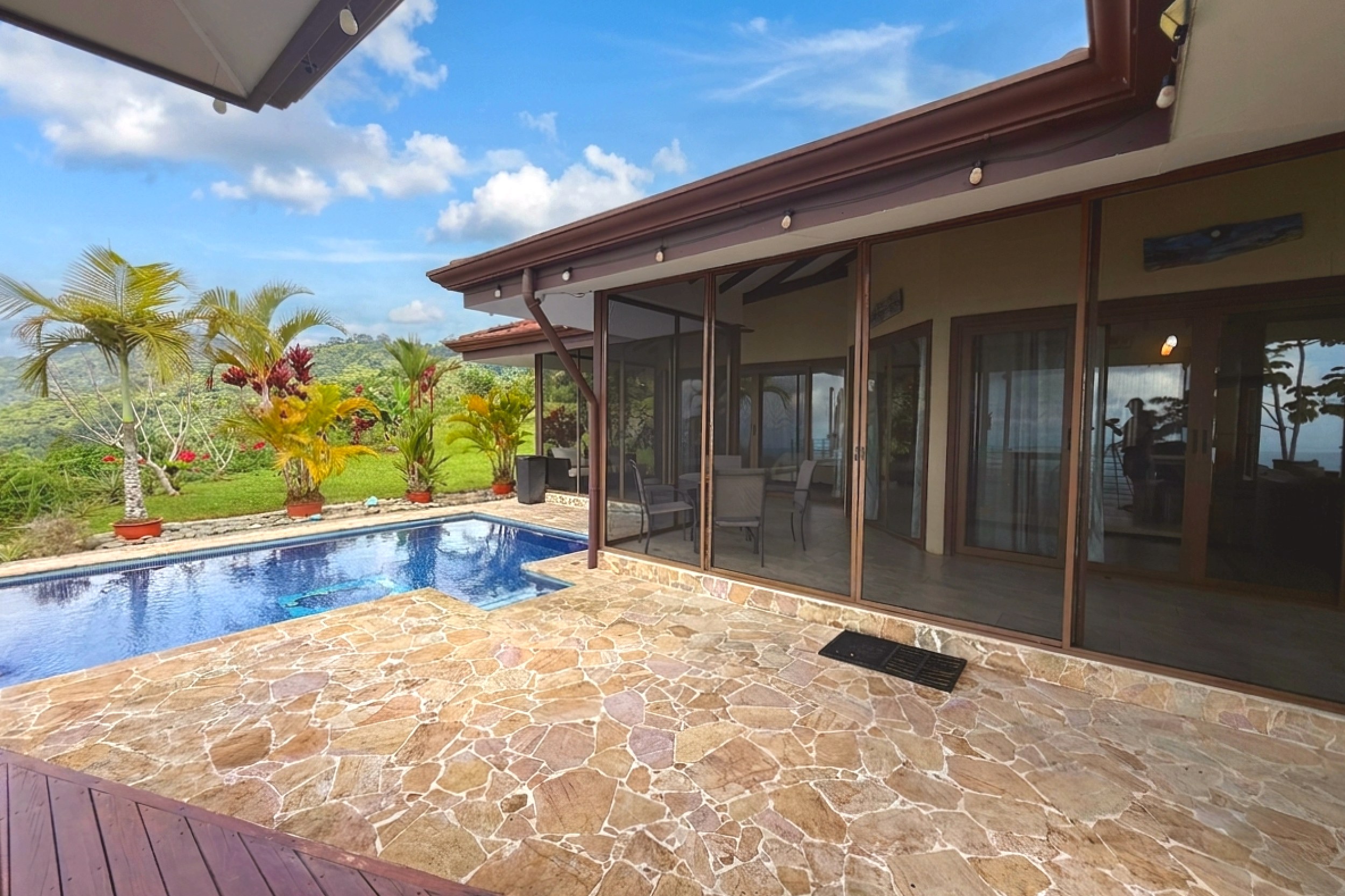 Ocean-View 3-Bedroom Home swimming pool and stone patio in Toucan Valley/Osa Mountain Village, Costa Rica