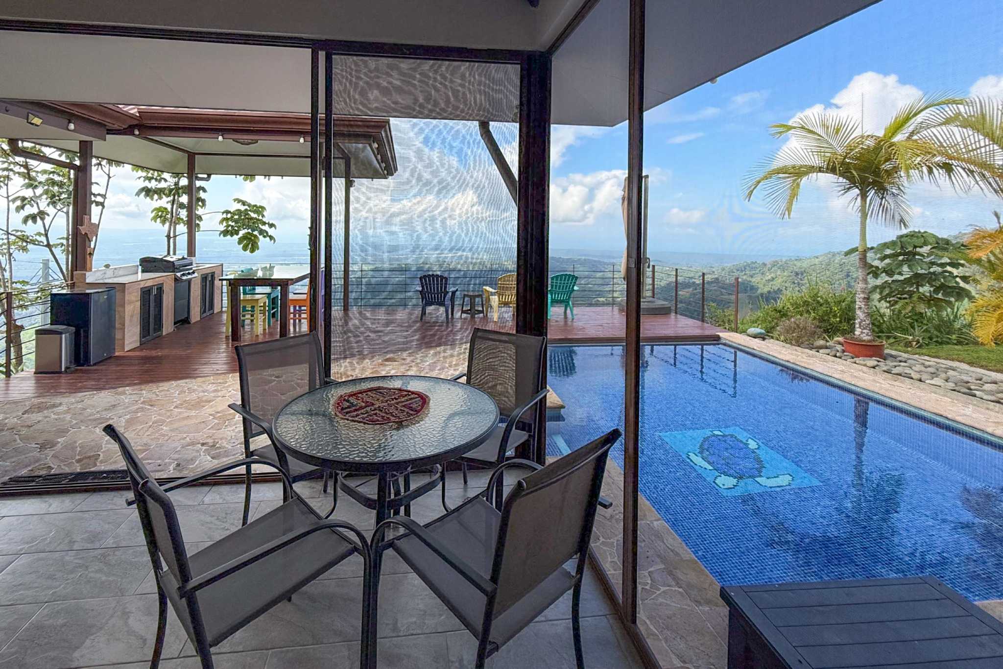 Terrace Dining & Pool Ocean-View 3-Bedroom Home terrace dining by pool in Toucan Valley/Osa Mountain Village, Costa Rica