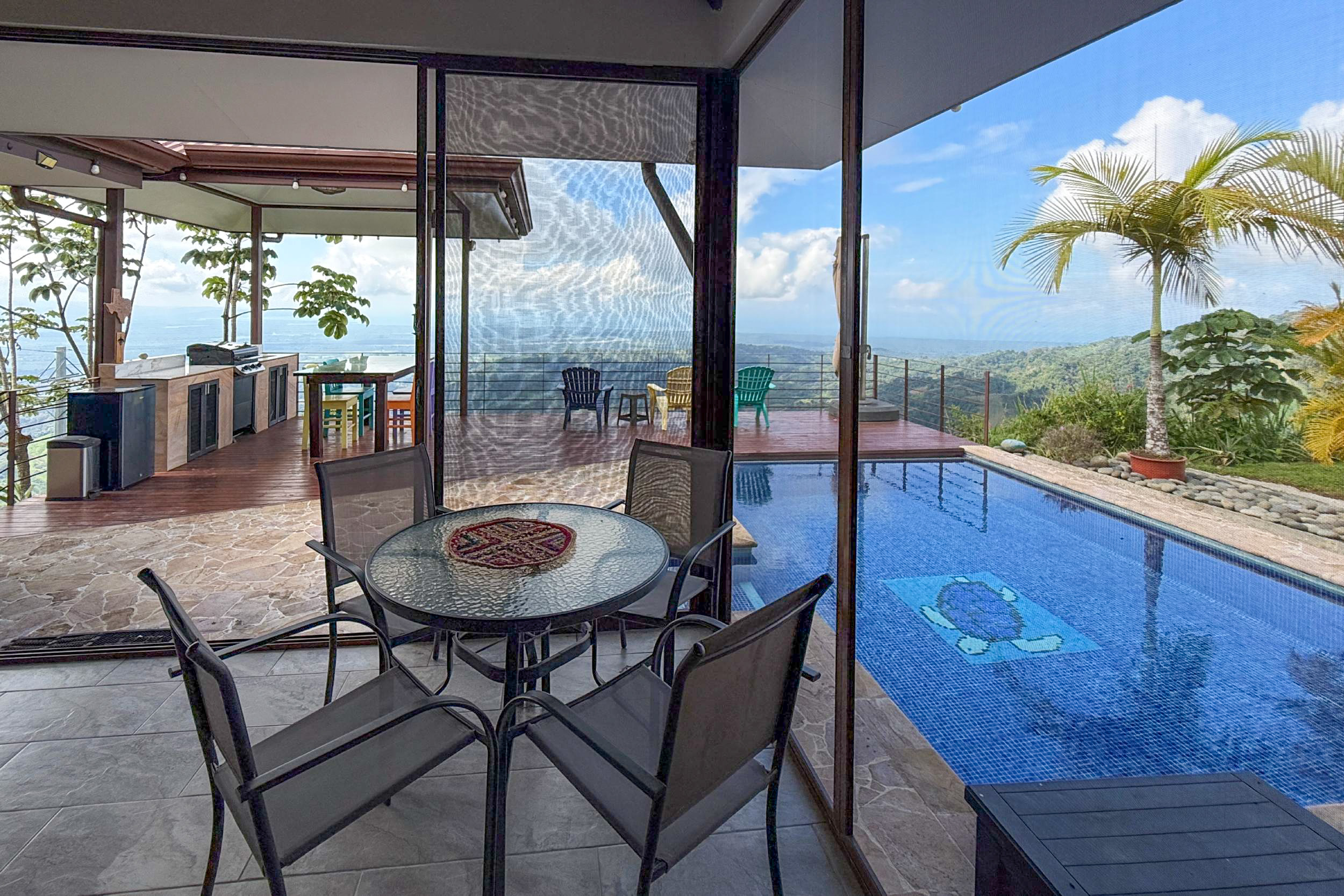 Ocean-View 3-Bedroom Home terrace dining by pool in Toucan Valley/Osa Mountain Village, Costa Rica