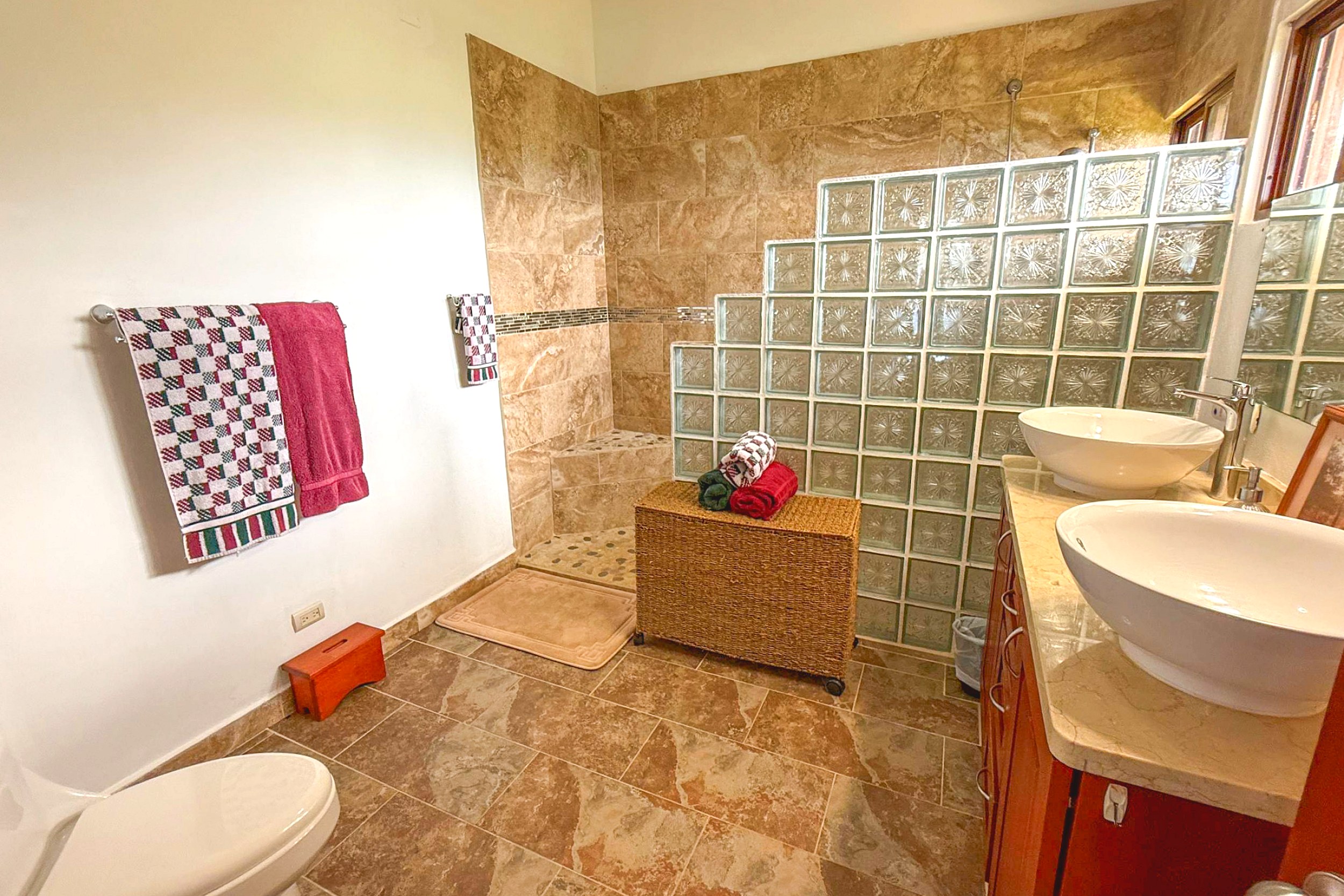Ocean-View 3-Bedroom Home guest bathroom with glass blocks in Toucan Valley/Osa Mountain Village, Costa Rica