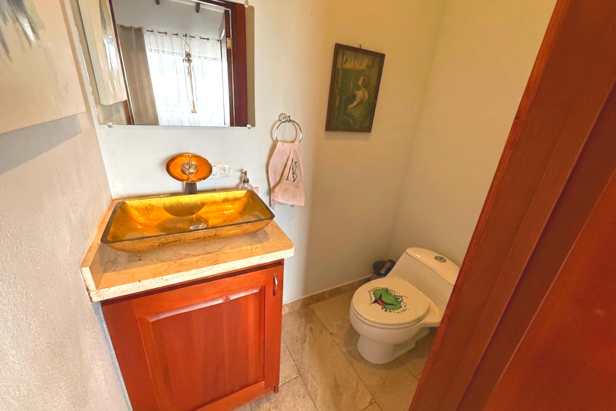 Ocean-View 3-Bedroom Home guest bathroom with gold sink in Toucan Valley/Osa Mountain Village, Costa Rica