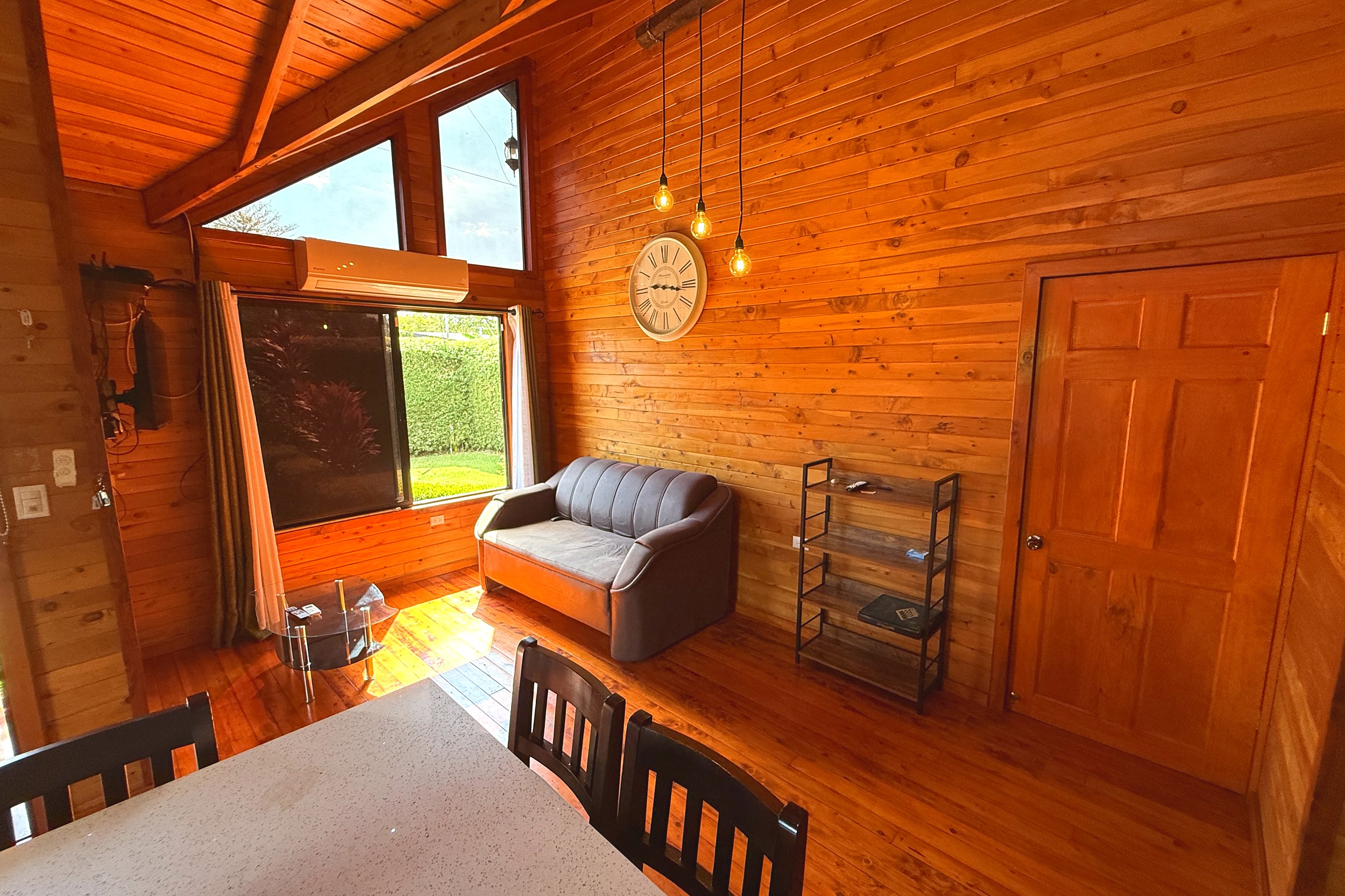 Cozy Wooden Living Room Unique Income Producing Home wooden living area with sofa in Bahia, Costa Rica