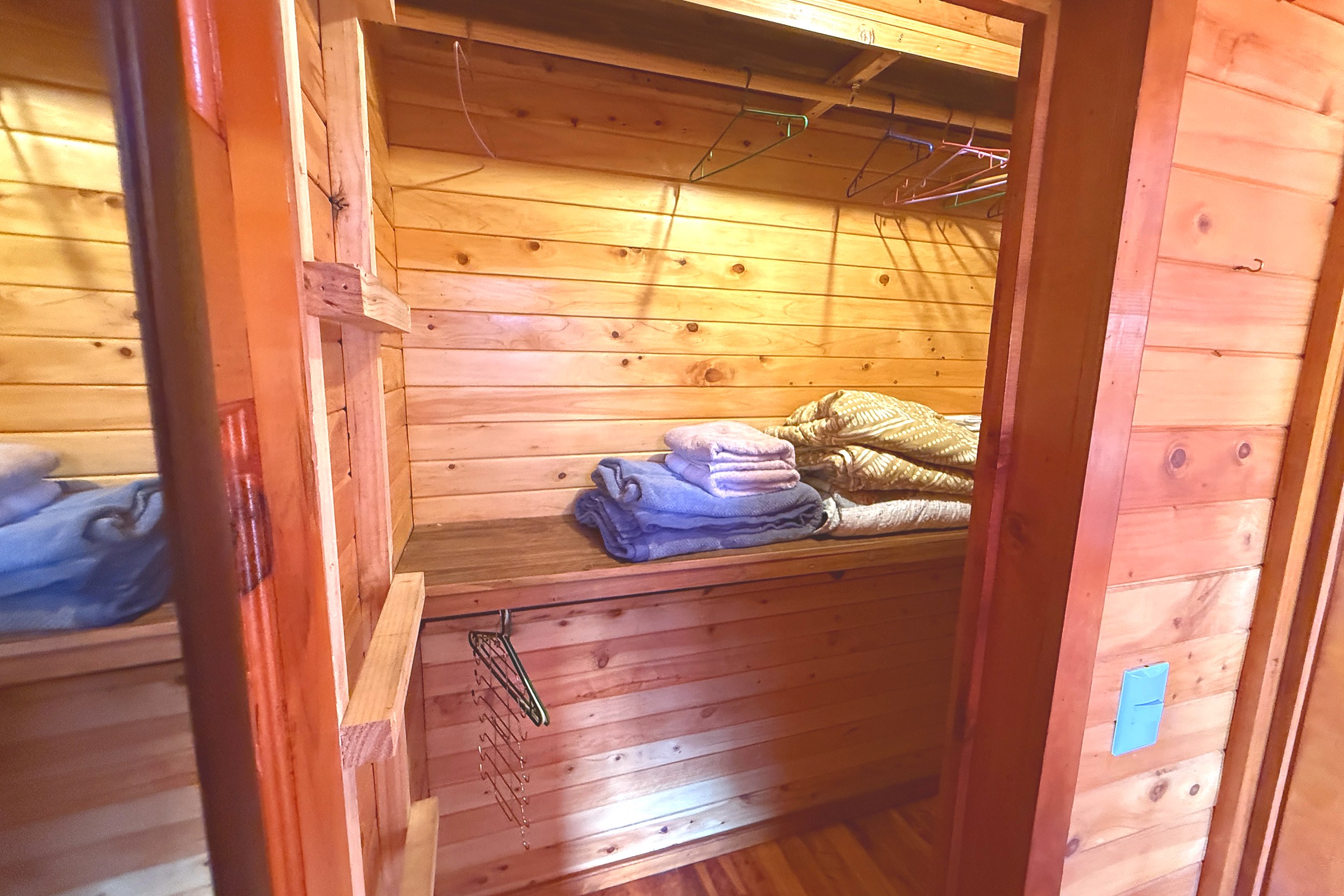 Master Closet Storage Income Producing Home and Cabin wood closet with folded linens in Bahia, Costa Rica.