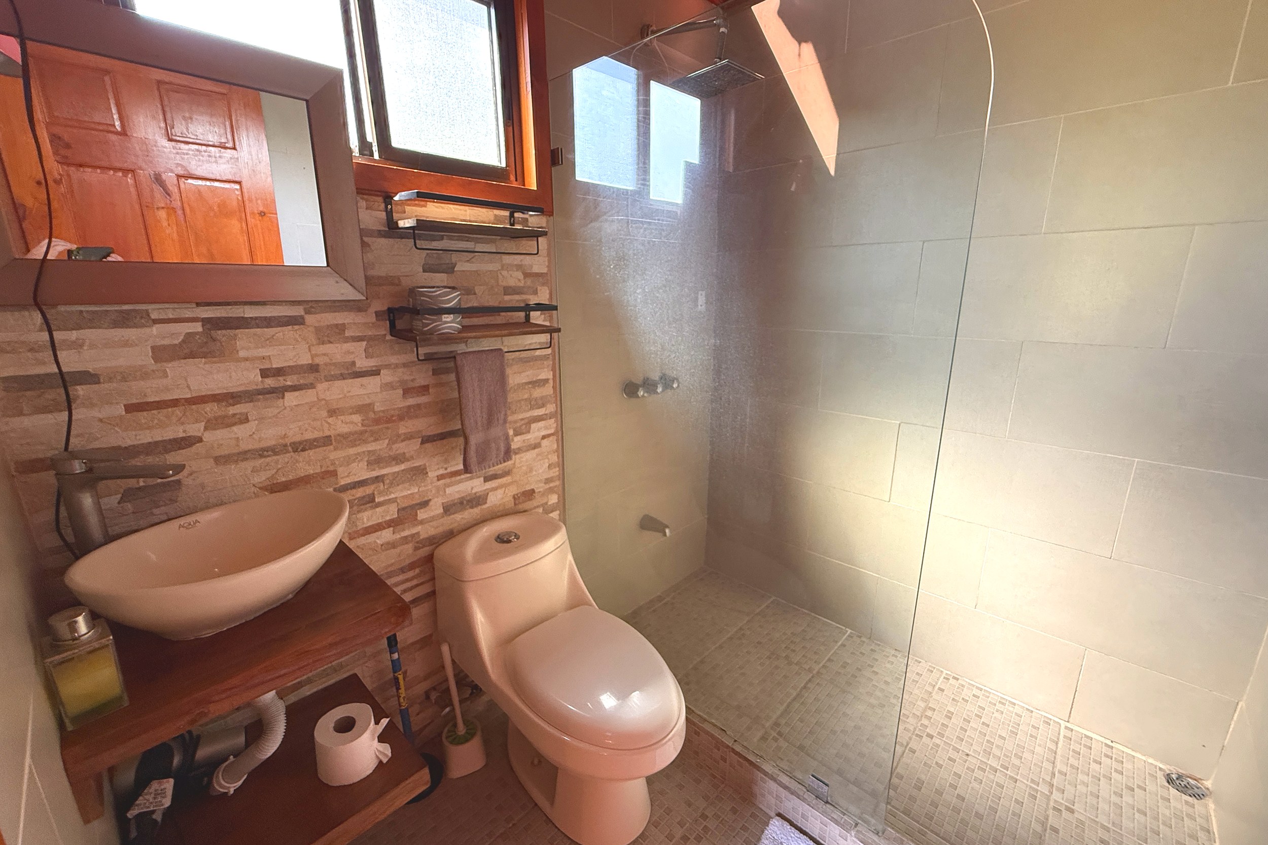 Bathroom with Glass Shower Unique Income Producing Home bathroom with tile glass shower and vessel sink in Bahia, Costa Rica