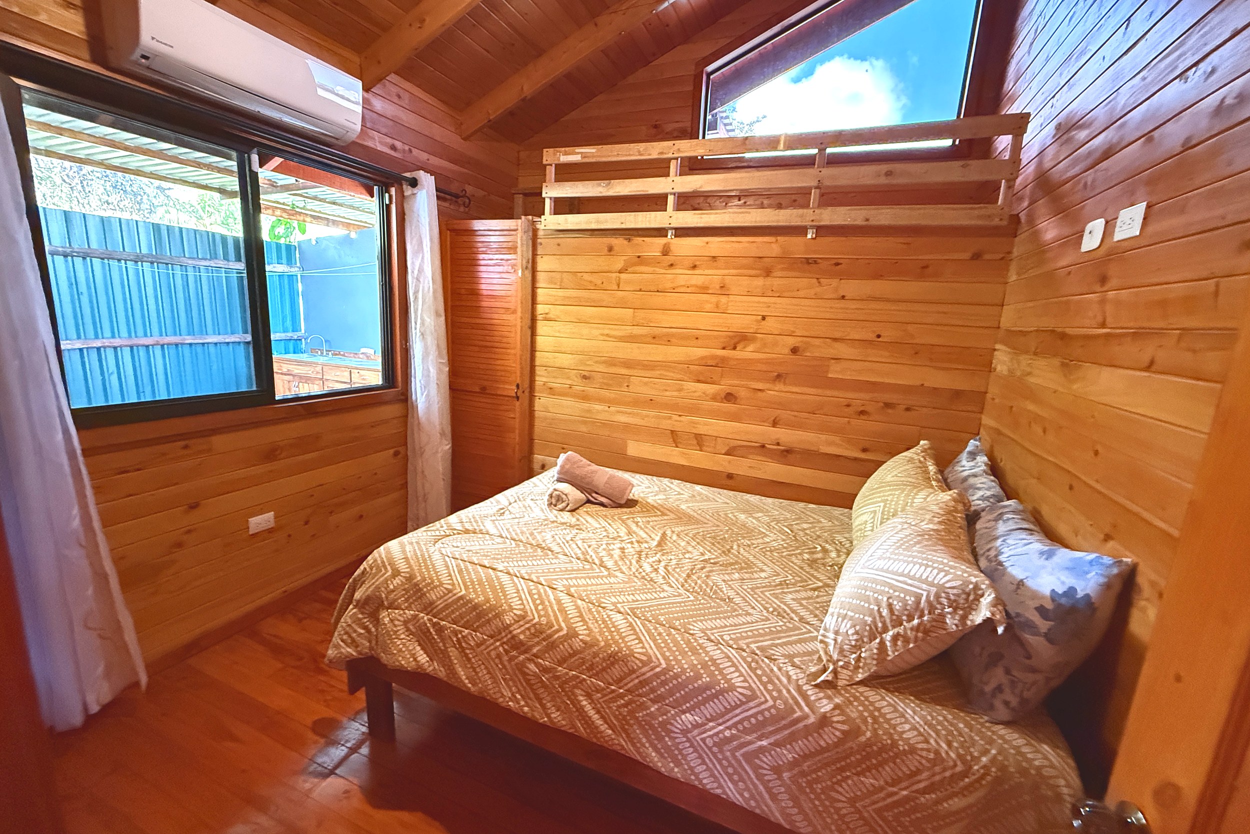 Rustic Cabin Bedroom Unique Income Producing Home rustic wood-paneled bedroom in Bahia, Costa Rica