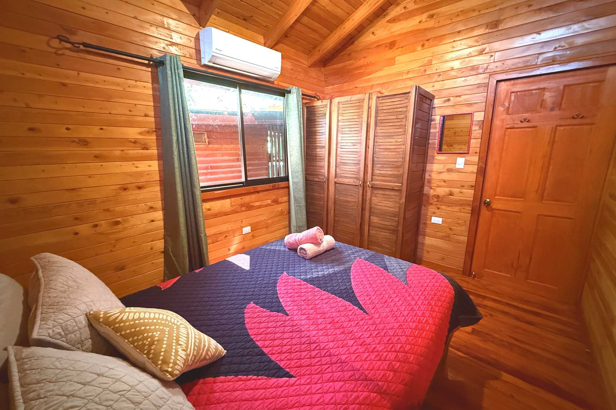 Cozy Cabin Bedroom Income Producing Home and Cabin wooden bedroom with bed in Bahia, Costa Rica