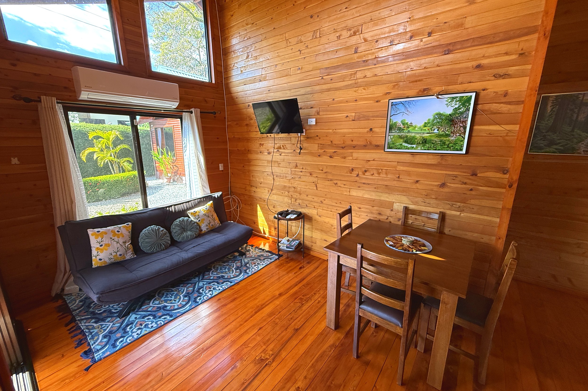 Cozy Living & Dining Area Unique Income Producing Home wooden living and dining area in Bahia, Costa Rica